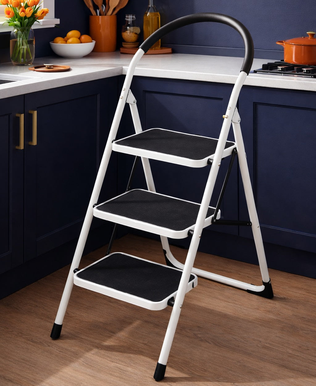 Step ladder in a kitchen setting with dark blue cabinets and a white countertop.