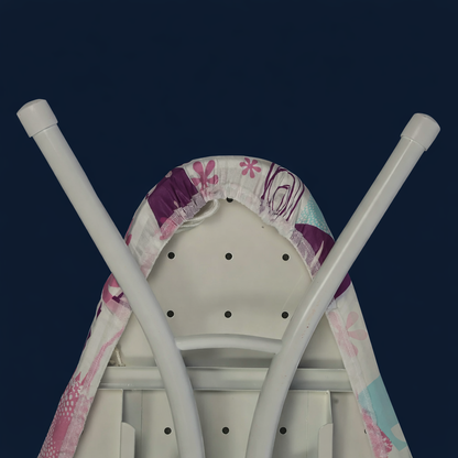 Ironing board with floral cover on a dark blue background