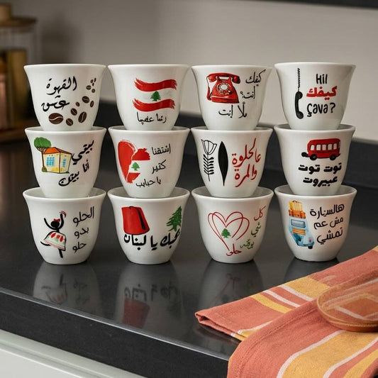 Set of small cups with various designs on a kitchen counter