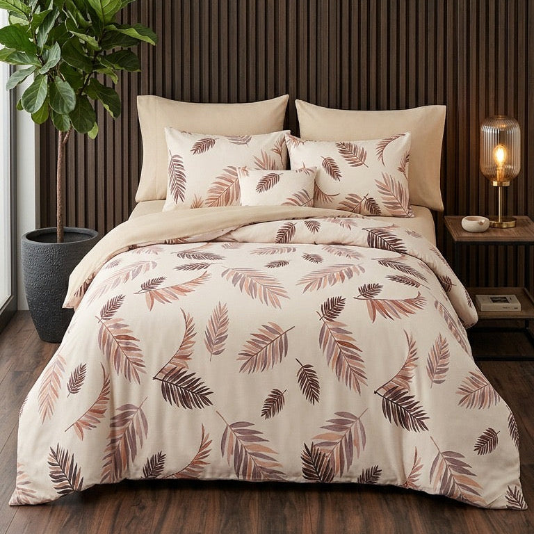 Bedroom with floral bedding and decorative pillows against a wooden paneled wall.