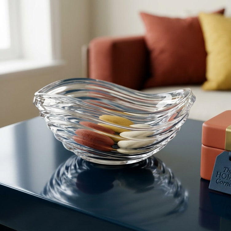 Glass bowl with colorful items on a table in a living room setting