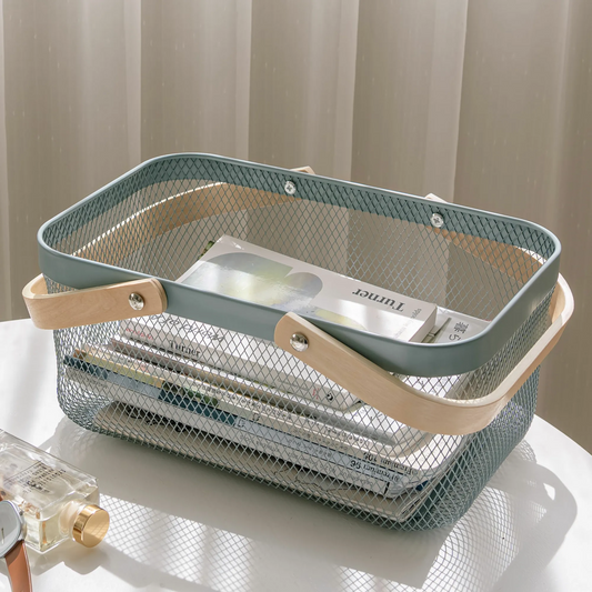 Mesh storage basket with wooden handle on a white surface