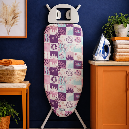 Decorative ironing board with a colorful pattern in a home setting.