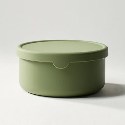 Green storage container with lid on a white background